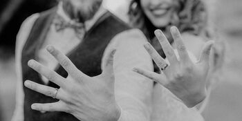 Couple showing wedding rings photo by Thinkstock