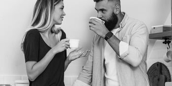Couple talking with coffee istock