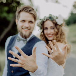 Couple showing wedding rings photo by Thinkstock