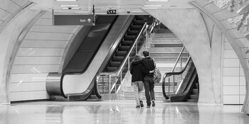 Couple traveling through the metro by engin akyurt