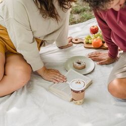 Couple having picnic in spring by amina filkins on pexels