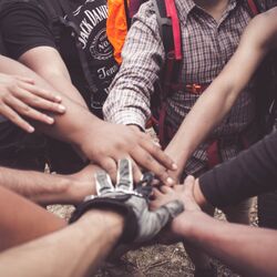 Hands in group community by dio hasbi on pexels