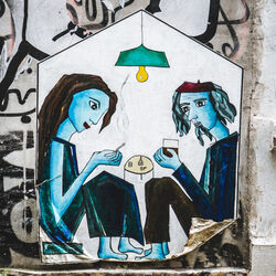 Grafitti couple in lockdown house Photo by Mika Baumeister on Unsplash